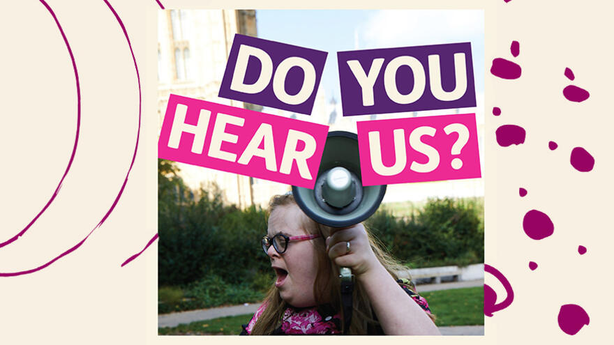 Heidi holding up a loudspeaker with the words Do you hear us? on top of the image